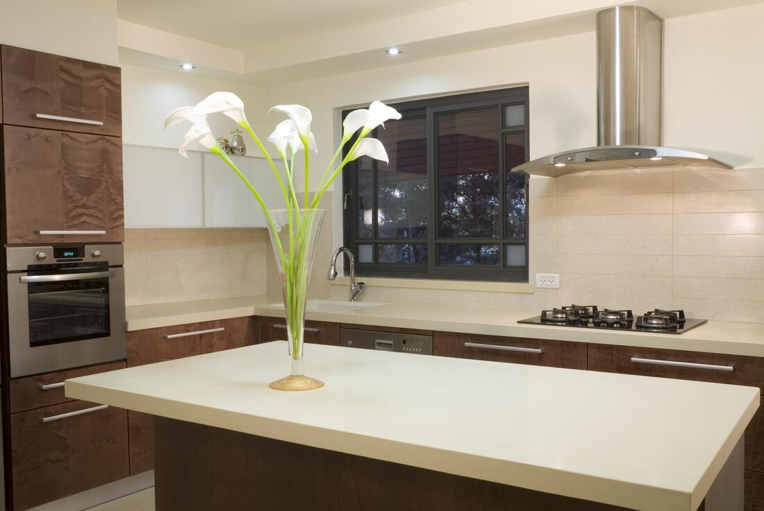 a flowervase on countertop